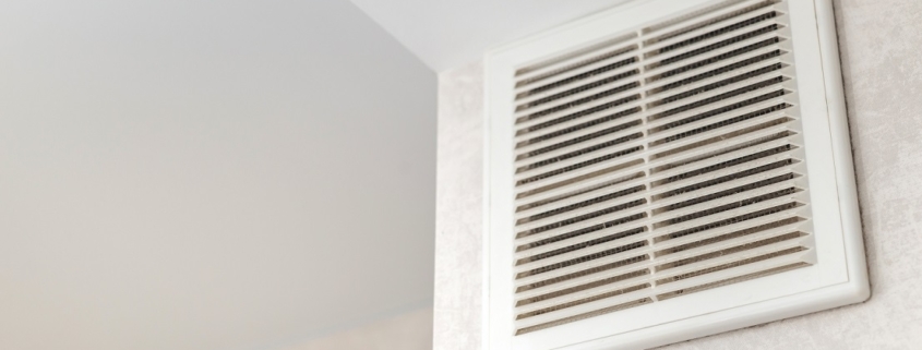 Dirty ventilation grille in the kitchen on the wall. Communication in the kitchen. Grease and dirt on the ventilation.