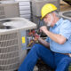man providing maintenance to HVAC system